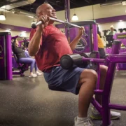 a man strength training at Planet Fitness