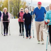 older people walking with poles