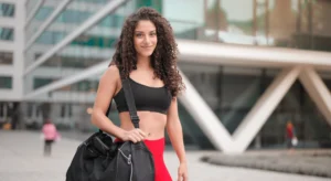 Young woman with gym bag