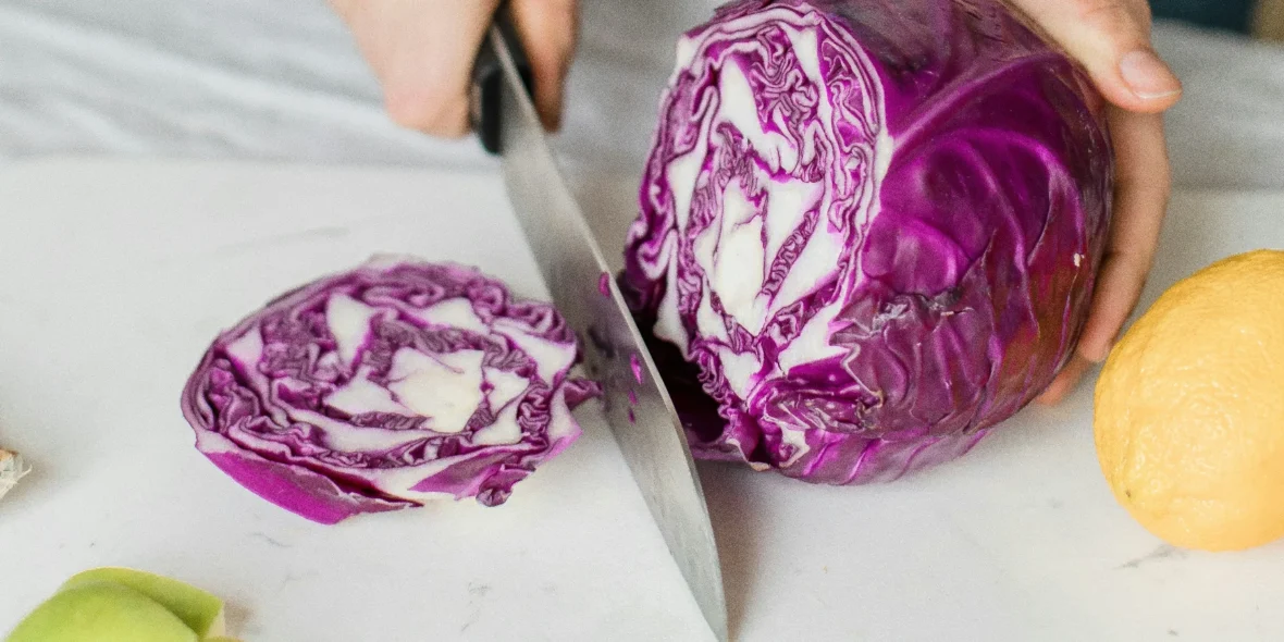 woman cutting cabbage/healthy eating