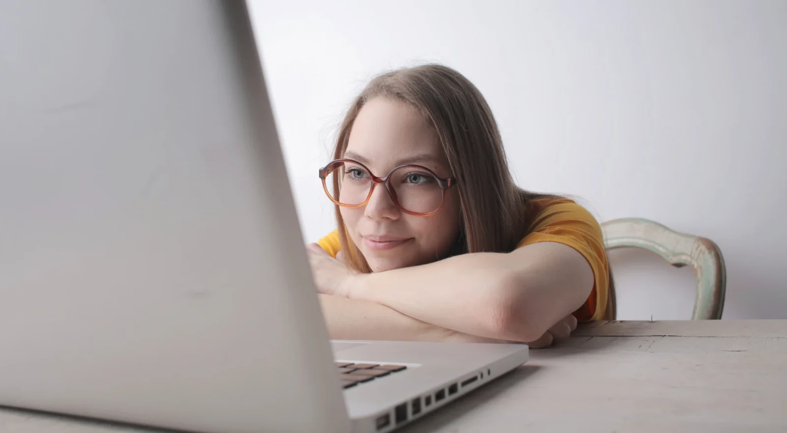 young woman looking at laptop