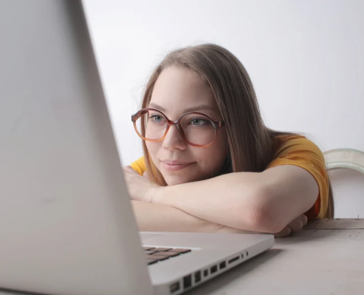 young woman looking at laptop