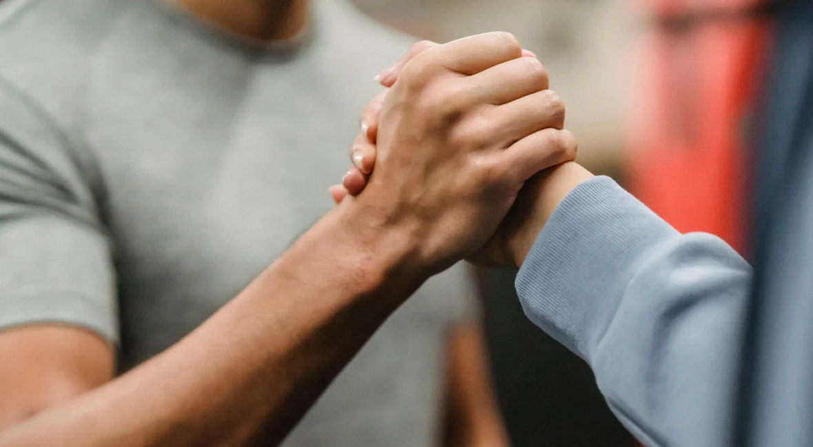 Two people clasping hands