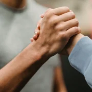 Two people clasping hands