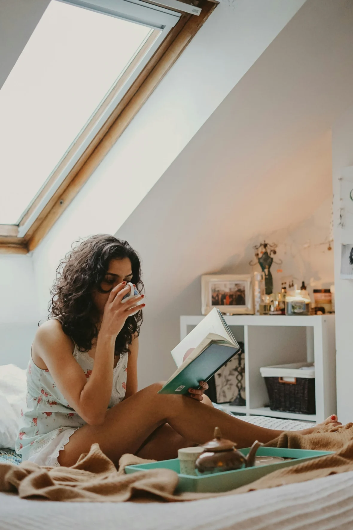 an image of a woman reading in bed/health and wellness