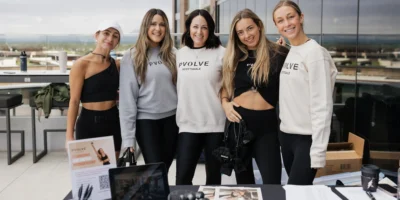 women in Pvolve clothing smile for a group photo