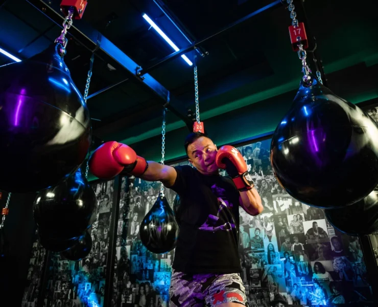 man hits a boxing bag