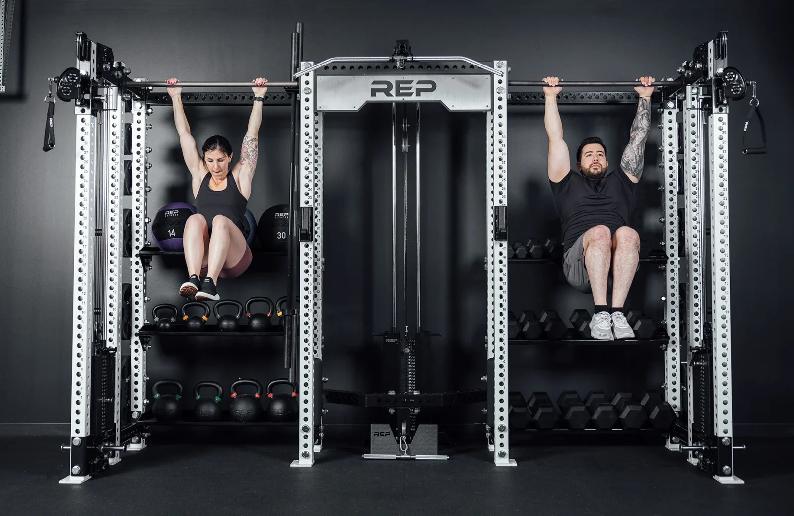 Two people working out on a Hyperion from REP Fitness