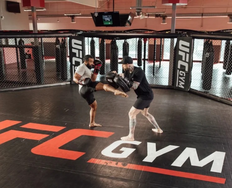 a workout at UFC Gym in the octagon