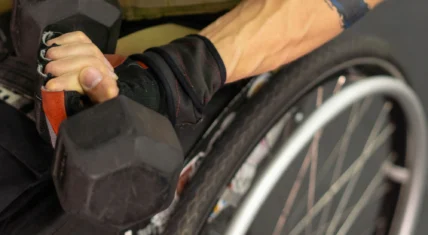 Man in wheelchair with dumbbell