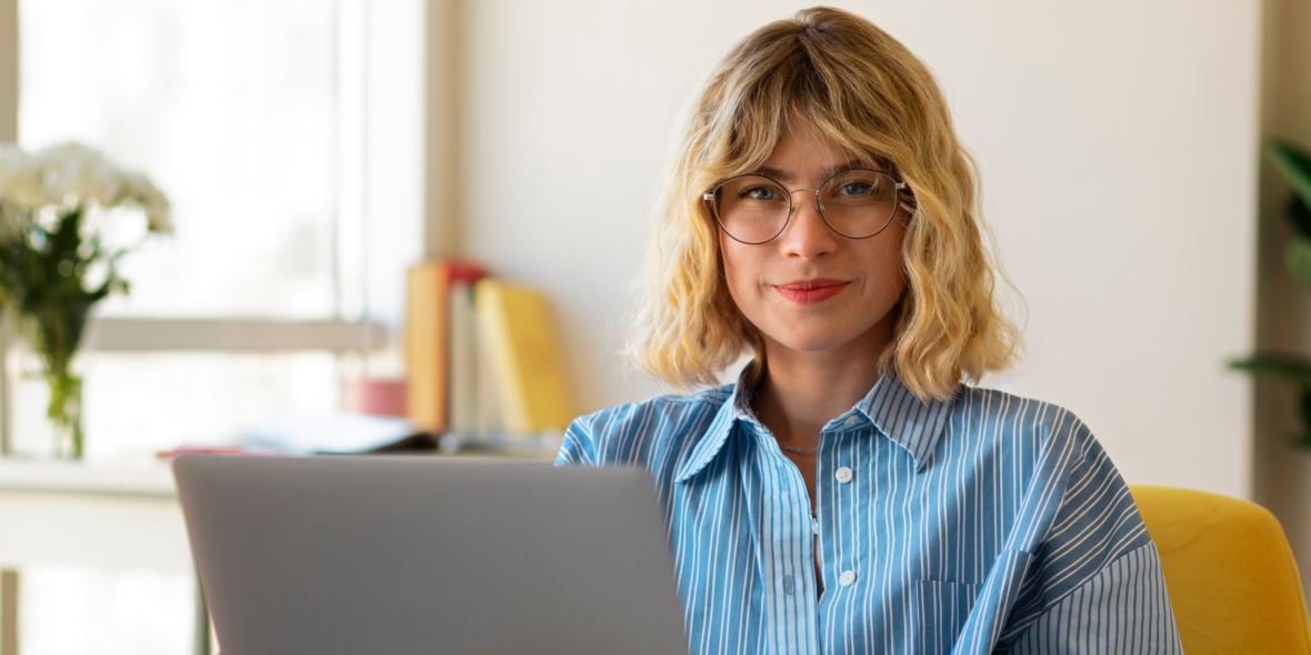 woman sitting behind laptop