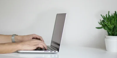 a person typing on a laptop
