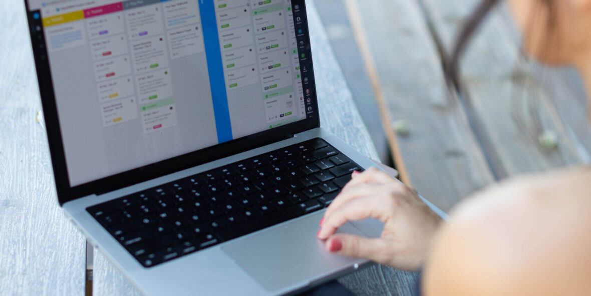 a woman behind a computer screen