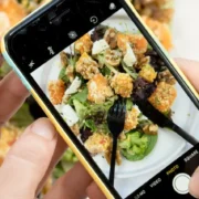 a man taking a photo of his food