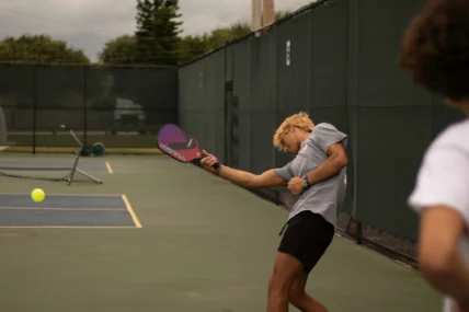 a man playing pickleball