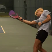 a man playing pickleball