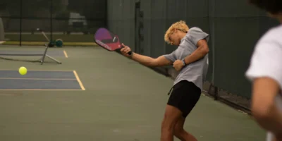a man playing pickleball