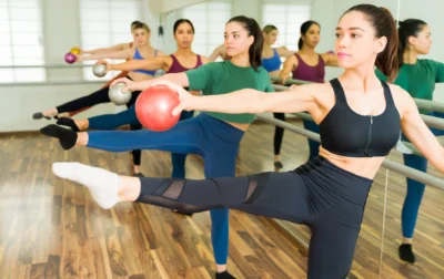 women work out inside a barre studio