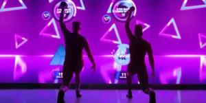 The Lumin Fitness experience; two members in front of immersive screen.