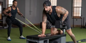 a man using the Fitbench in the gym.