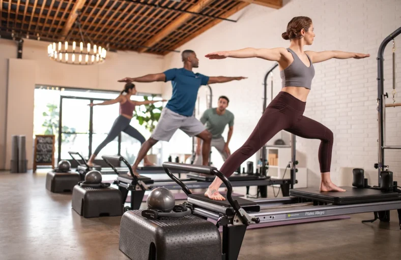 People in a reformer class