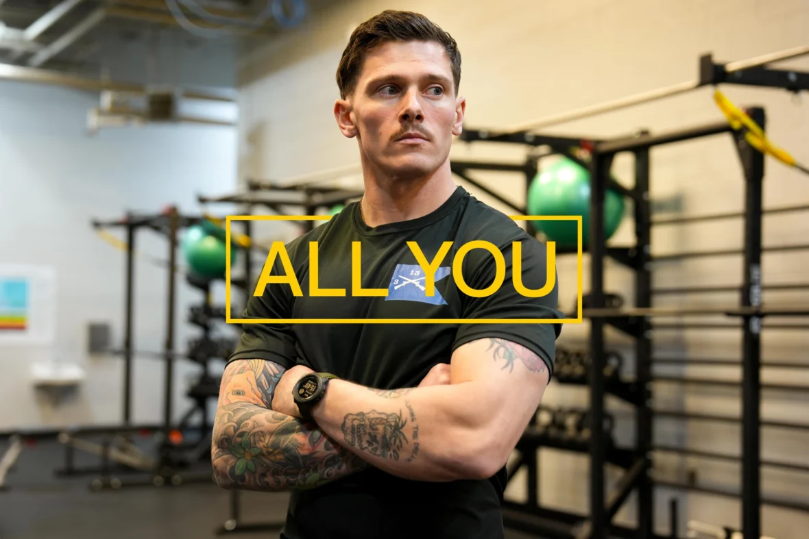 A U.S. Army "All You" promo photo featuring a a man with tattoos.