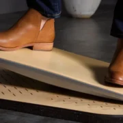 A man wearing nice shoes on an eco-friendly springboard from FluidStance.