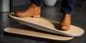 A man wearing nice shoes on an eco-friendly springboard from FluidStance.