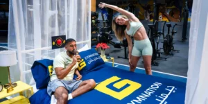 a man and woman staying at GymNation's concept hotel.