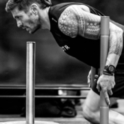 man pushing weights