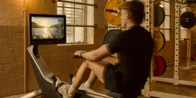 a man working out on a Hydrow at Soho house.