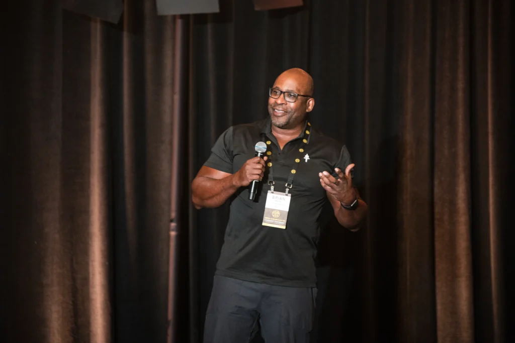 Gold's Gym SoCal senior vice president Brian Morris speaking at an event.