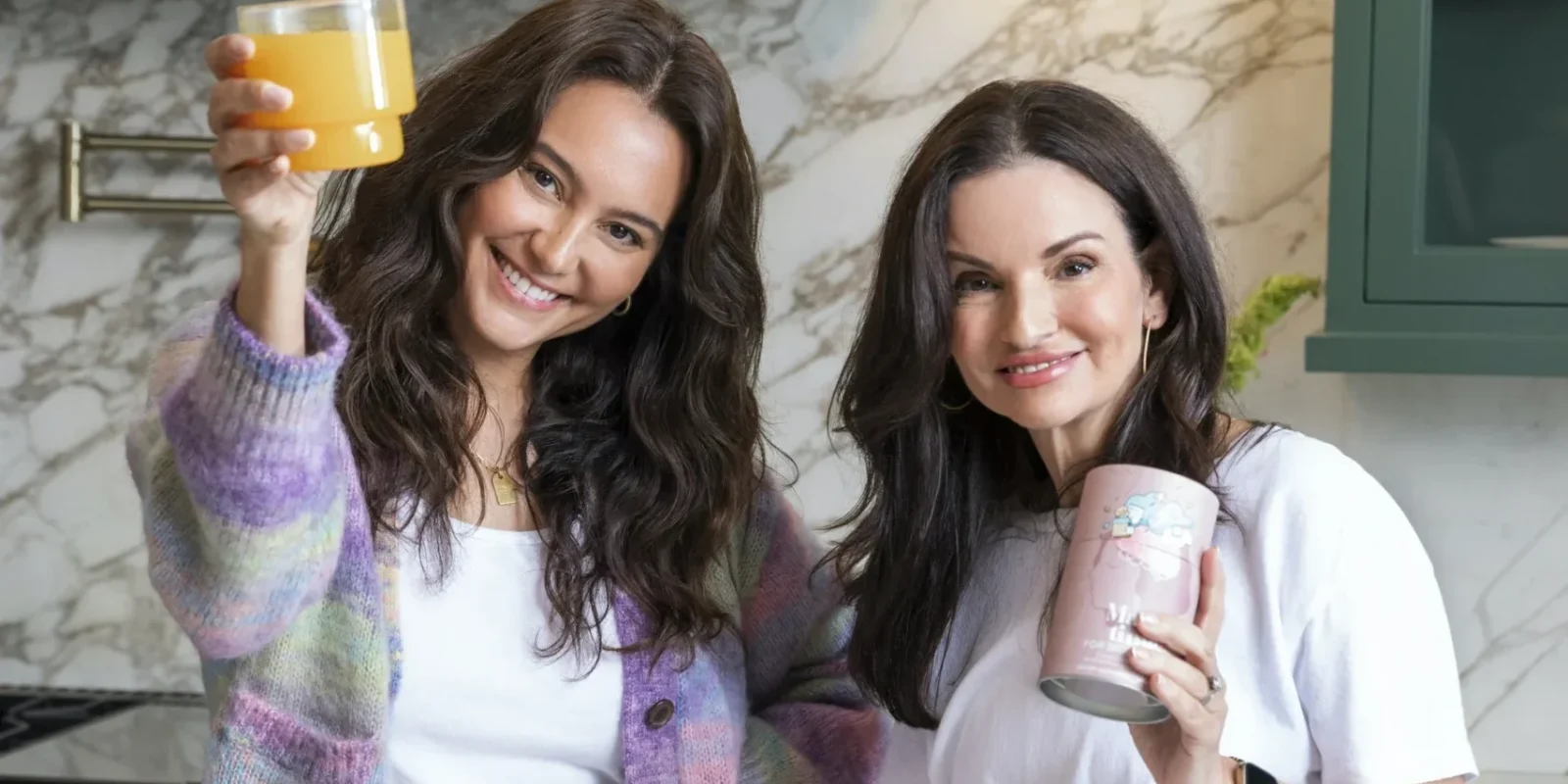 Make Time Wellness founders in a kitchen holding their products.