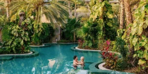 a couple in a pool at Zadún, a Ritz-Carlton Reserve