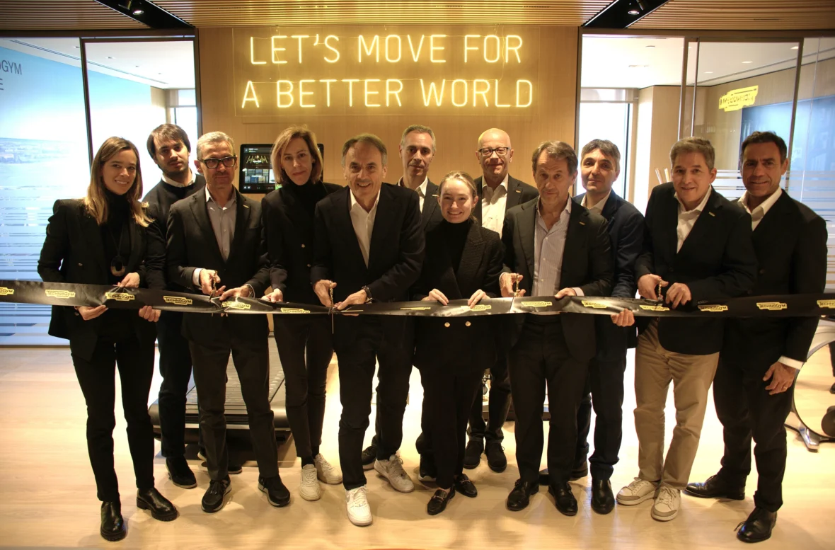 a group shot of Technogym team members cutting a ribbon to their new HQ in NJ.