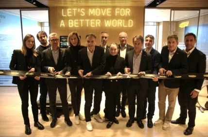 a group shot of Technogym team members cutting a ribbon to their new HQ in NJ.