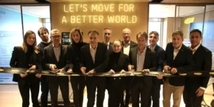 a group shot of Technogym team members cutting a ribbon to their new HQ in NJ.