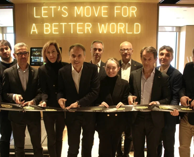 a group shot of Technogym team members cutting a ribbon to their new HQ in NJ.