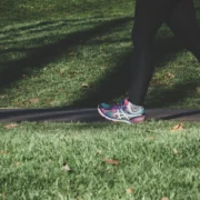 person walking on grass