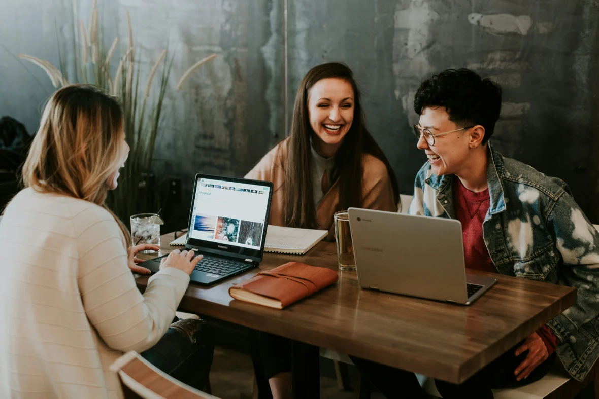 A group of happy employees seated at a table.