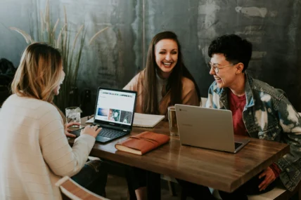 A group of happy employees seated at a table.