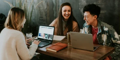 A group of happy employees seated at a table.