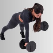 woman using Core Home Fitness dumbbells