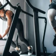people working out side by side at a gym