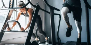 people working out side by side at a gym