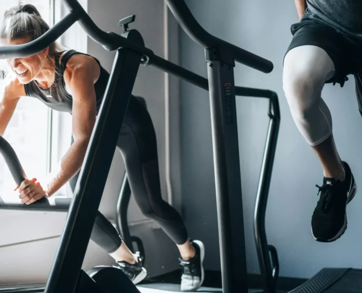 people working out side by side at a gym