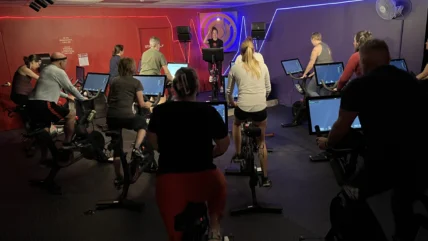 A group fitness class with Peloton bikes.