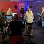 A group fitness class with Peloton bikes.
