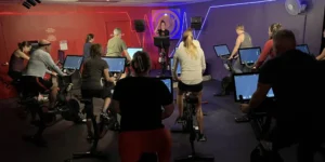 A group fitness class with Peloton bikes.