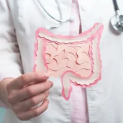 Doctor holding up modeled instestine